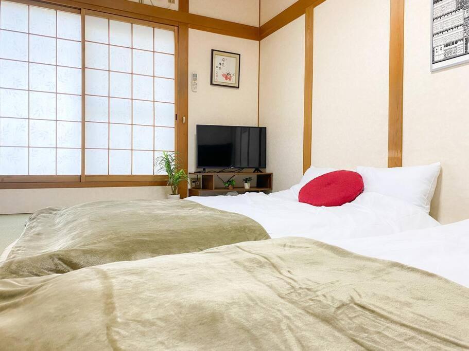 Apartment 団,最大16名,レンタルサイクル無料,usjまで好アクセスの3階建て Osaka